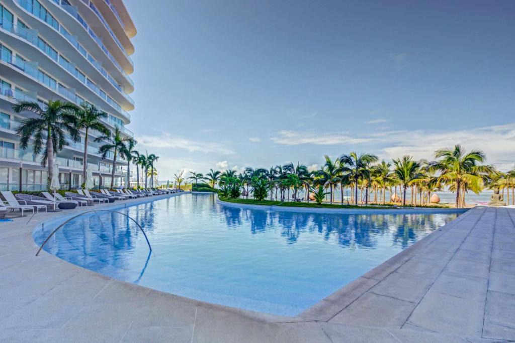 Flamingos Apartment | NEW Beachfront Marítima Playa Condos, 2 Pools and Gym