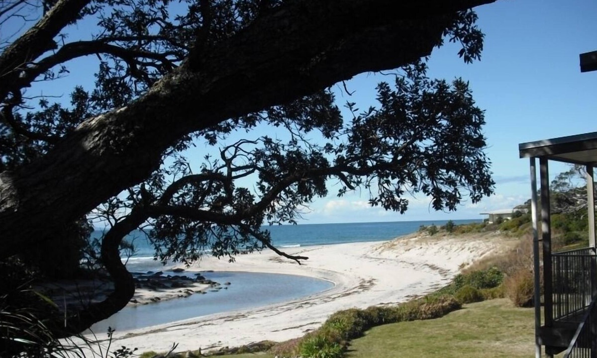 Whiritoa House | Walk straight onto the sand from the garden.
