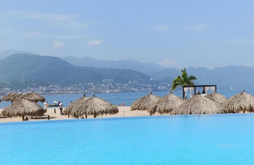 South Hotel Zone Condo | Available now! Beachside 2BR condo pools. 10min from PVR airport
