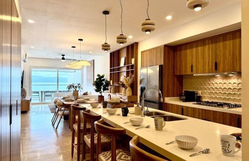 Las Glorias Apartment | Beachfront 2BR 2baths - 8 Pools by Moikkarentals