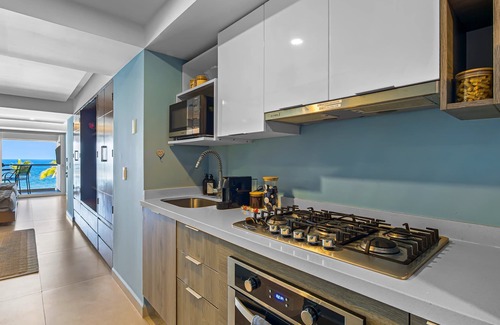 Las Glorias Apartment | Gorgeous 1BR Condo with Pools & Sea Views