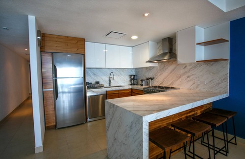South Hotel Zone Condo | Luxurious, Beachfront 2bed/2 bath Condo with Designer Finishes