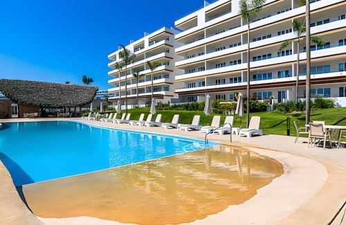 Flamingos Condo | New! Large balcony and pool, steps from the ocean