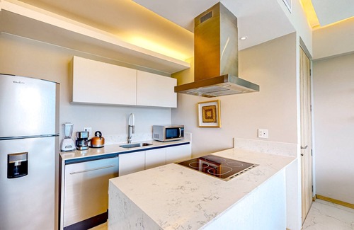 Flamingos Condo | Updated condo with sweeping views, pools, fitness room, balcony, W/D, and AC