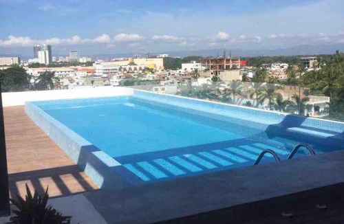 Diaz Ordaz Apartment | 15 Minute Walk to Beach KING Bed Rooftop Pool