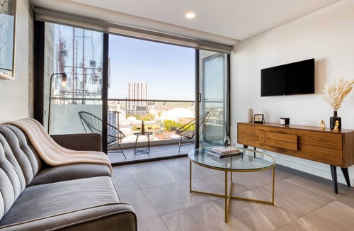 Avenida Revolucion Apartment | Amazing Apt w/a Pvt Balcony: Lounge-B/Center+Gym