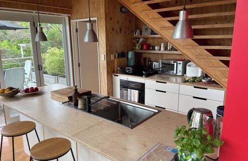 Onemana House | Architecturally designed bach in a quiet cul de sac overlooking a bush reserve