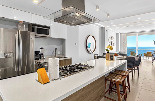Las Glorias Apartment | Beachfront 2BR - Pools & Scenic Balcony Views