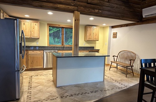 Ellsworth House | Beautiful private beach area within steps from the modern updated log home