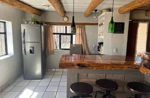 Creel Cabin | Casa MiRó Creel, a cozy place with an indoor fireplace.