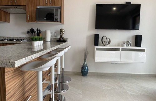 North Hotel Zone Condo | Charm & Champagne with a little R&R