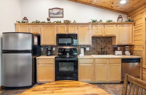Branson Theater District Cabin | Cozy Walk-in Cabin with Fireplace, Jacuzzi, and Private, Covered Balcony