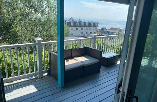 Hull Condo | Direct ocean view 2 bed 2 bath 36 ft deck walk to beach.