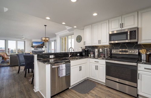 Ocean City Condo | Enjoy a large, spacious designer unit with all the extras plus an indoor pool, outdoor pool, fitness room, assigned parking and shops on the ground level.