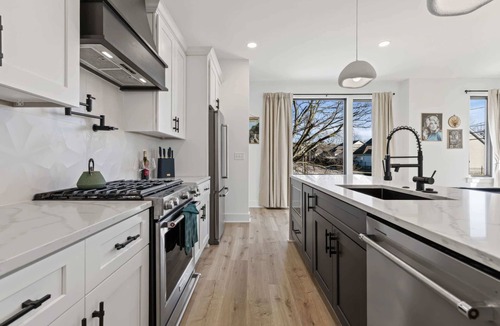Hurwood Heights House | Fall rooftop hot tubs, two homes, game rooms near Broadway and Geodis Park