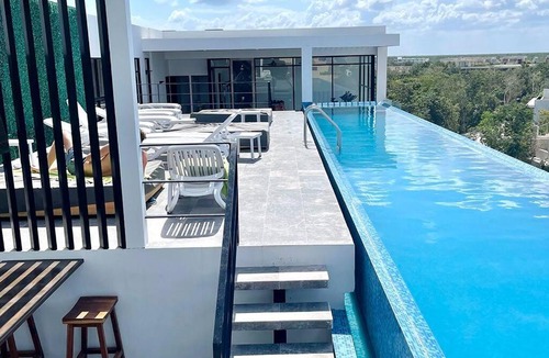 Zama Apartment | Fresh and Stylish Studio Aldea Zama rooftop pool Mya 109