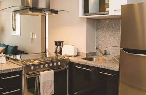 Ampliacion Granada Apartment | Fully equipped kitchen, high speed internet, comfy king-size bed and a sofa bed.
