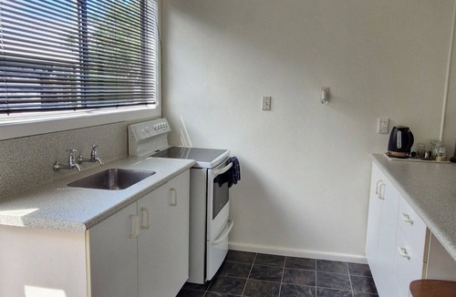 Napier House | Fully self contained unit with separate bedroom on beachfront property,