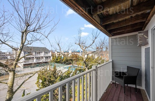 Heron Harbour Isle House | Gorgeous Bayside 3 Bedroom Townhome with 4 Private Balconies and Outdoor Community Pool!