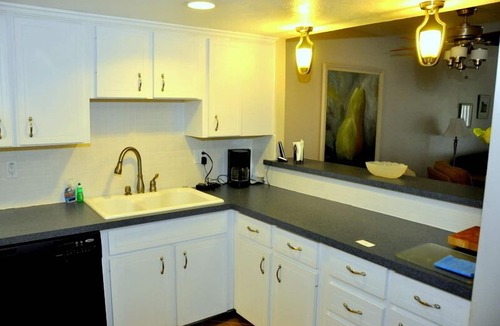 New Smyrna Beach Condo | Ground Floor! Keep your toys and fishing gear on the patio!