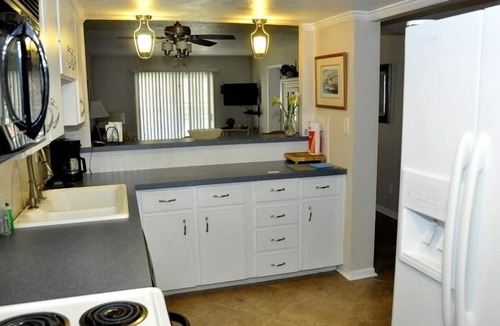 New Smyrna Beach Condo | Ground Floor! Keep your toys and fishing gear on the patio!