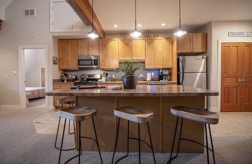 Traverse City Condo | Historic Top-Floor Condo in Downtown Traverse City – Walk to Beaches & Dining