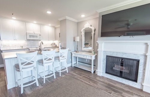 Boyne City Condo | Lake Charlevoix Views | Private Patio | Steps to Sand & Shoreline |