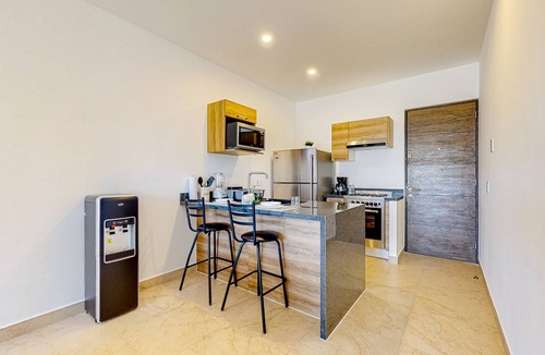 Akumal Apartment | Lock-off apartment with balcony, rooftop pool, & kitchen - near beach