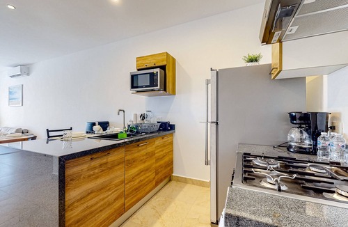 Akumal Apartment | Lock-off apartment with balcony, rooftop pool, & kitchen - near beach