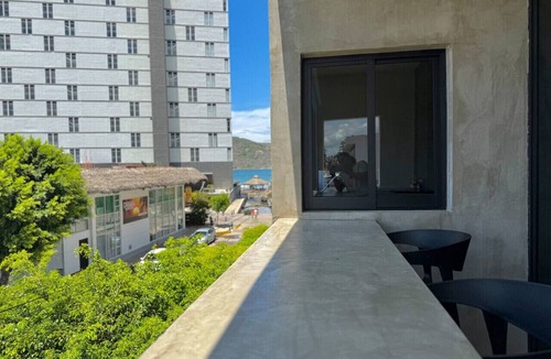 Zona Dorada Apartment | Loft Steps from the Beach By PartnerHostRentas