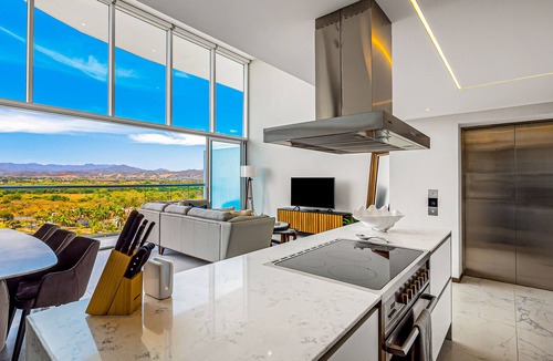 Flamingos Condo | Luxury ocean-view condo with resort pool, private balcony, and washer/dryer