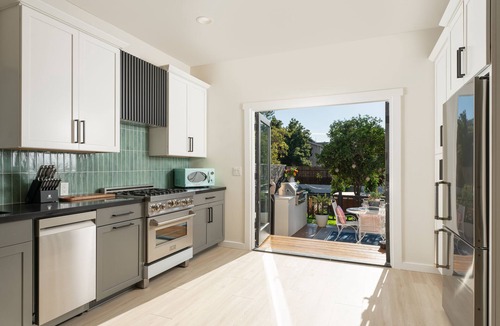 Oak Park House | Magical Downtown Oasis with Deck, Pergola, AC - 3 min to State St ● Pet Friendly