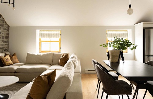 Ville-Marie Apartment | Maison Rasco One-Bedroom Apartment King Size Bed Old Montreal Full Kitchen Stone Wall Pet Friendly Self Check-In Access Wi-Fi AC