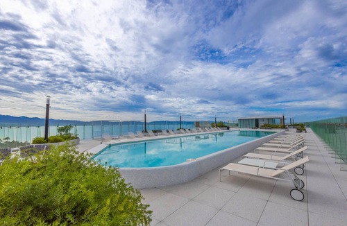 Flamingos Apartment | Marítima Beachfront Condo: 2 Pools, Gym, Balconies
