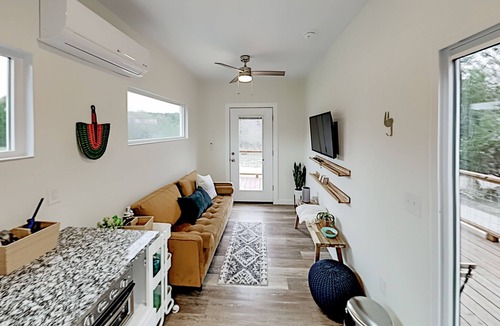 Spicewood House | Modern Container Home with Wraparound Deck & Covered BBQ Area
