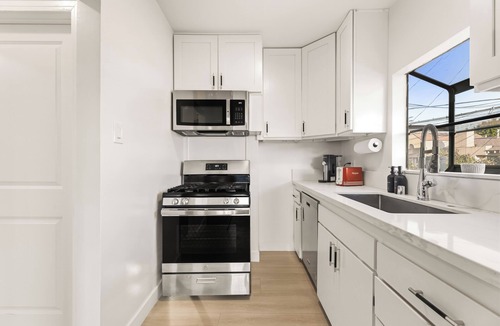 Eastside Apartment | Oversized Furnished 1BR in Rose Park with King Bed, W/D & Parking