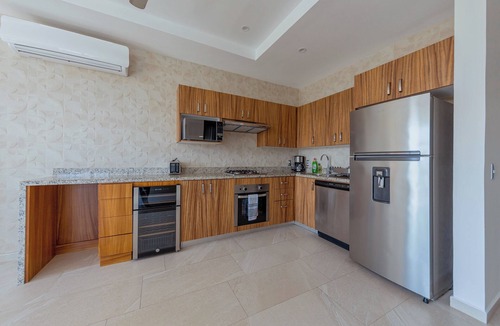 North Hotel Zone Condo | Porto Santo beautiful 1 bedroom flex, king bed+sofa bed steps from playa de oro.