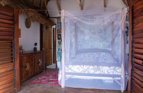 Mayto Cottage | Remote, romantic jungle palapa overlooking the ocean with 3 beds, kitchen + bath