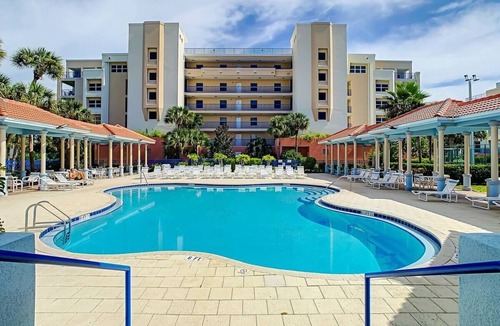 New Smyrna Beach Condo | Resort style amenities in spacious condo with beach access and direct pool view.