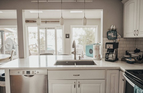 Portage Lakes Cottage | SLICE OF HEAVEN lake front cottage with HOTTUB, fire pit, kayaks & Dog friendly!