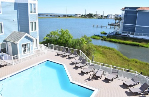 Chincoteague Condo | Sunset Bay Villa #210- Waterfront Condo in Town, Pool, Gym
