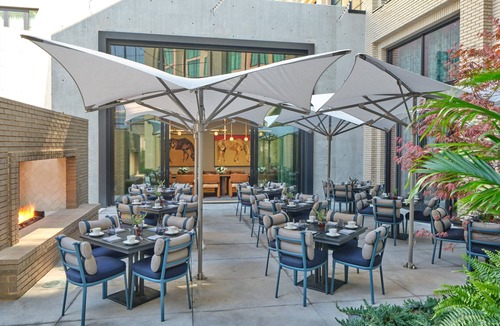 Fort Worth Cultural District Hotel | The Crescent Hotel | Patio Deluxe Queen Queen | Walk to National Cowgirl Museum