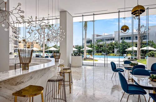 Flamingos Condo | Updated condo with sweeping views, pools, fitness room, balcony, W/D, and AC