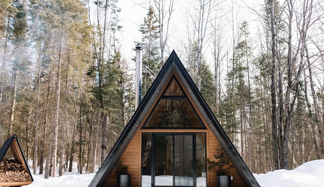 A Frame Cabin at the top of a ski hill