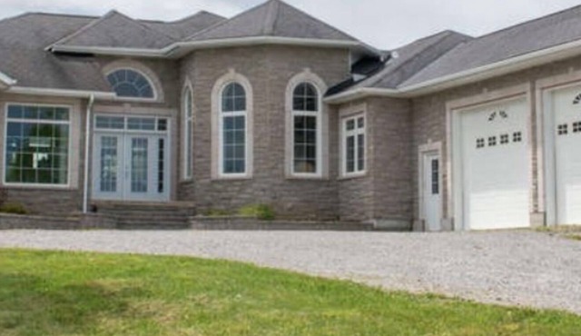Amazing custom home with with it's own all season hockey rink.
