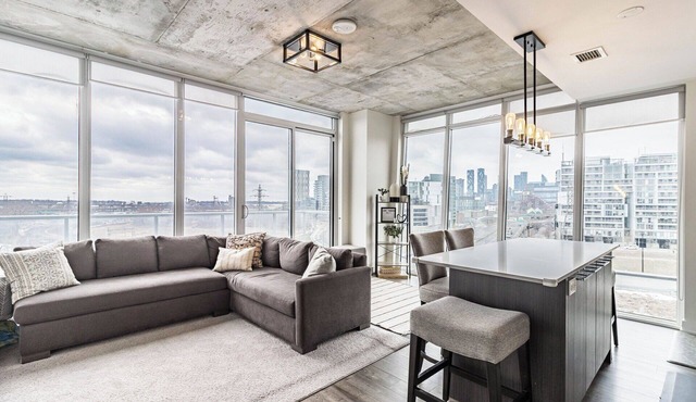 Beautiful corner unit with floor to ceiling windows in prime South Riverdale