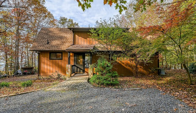 Enchanting lakefront oasis with fire pit, generous patio, dock, & amazing views