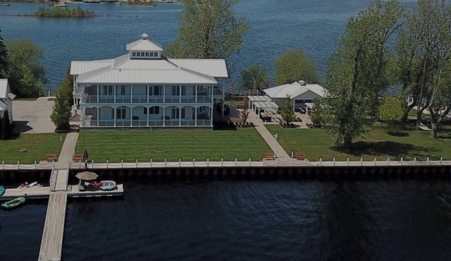 Gorgeous cottage surrounded by 320 degrees of water. Sleeps 16 people