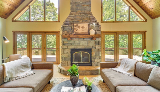 New Listing! Timber Ridge Lake House is a private home in Amery Wisconsin on Lake Wapogasset/Bear Trap. The home balances the warmth of a large A-Frame with modern decor and finishes providing a serene stay with woods and lake views.