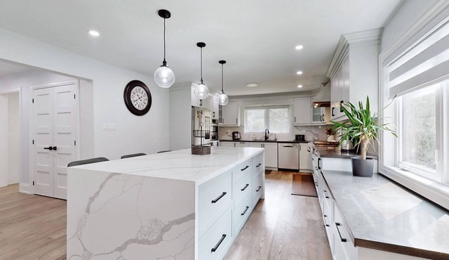 Newly renovated luxury Home with deck, surrounded by trees on a 5 acres land